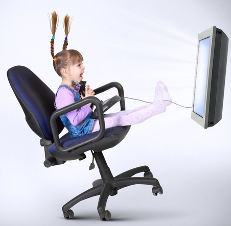 child girl playing computer game